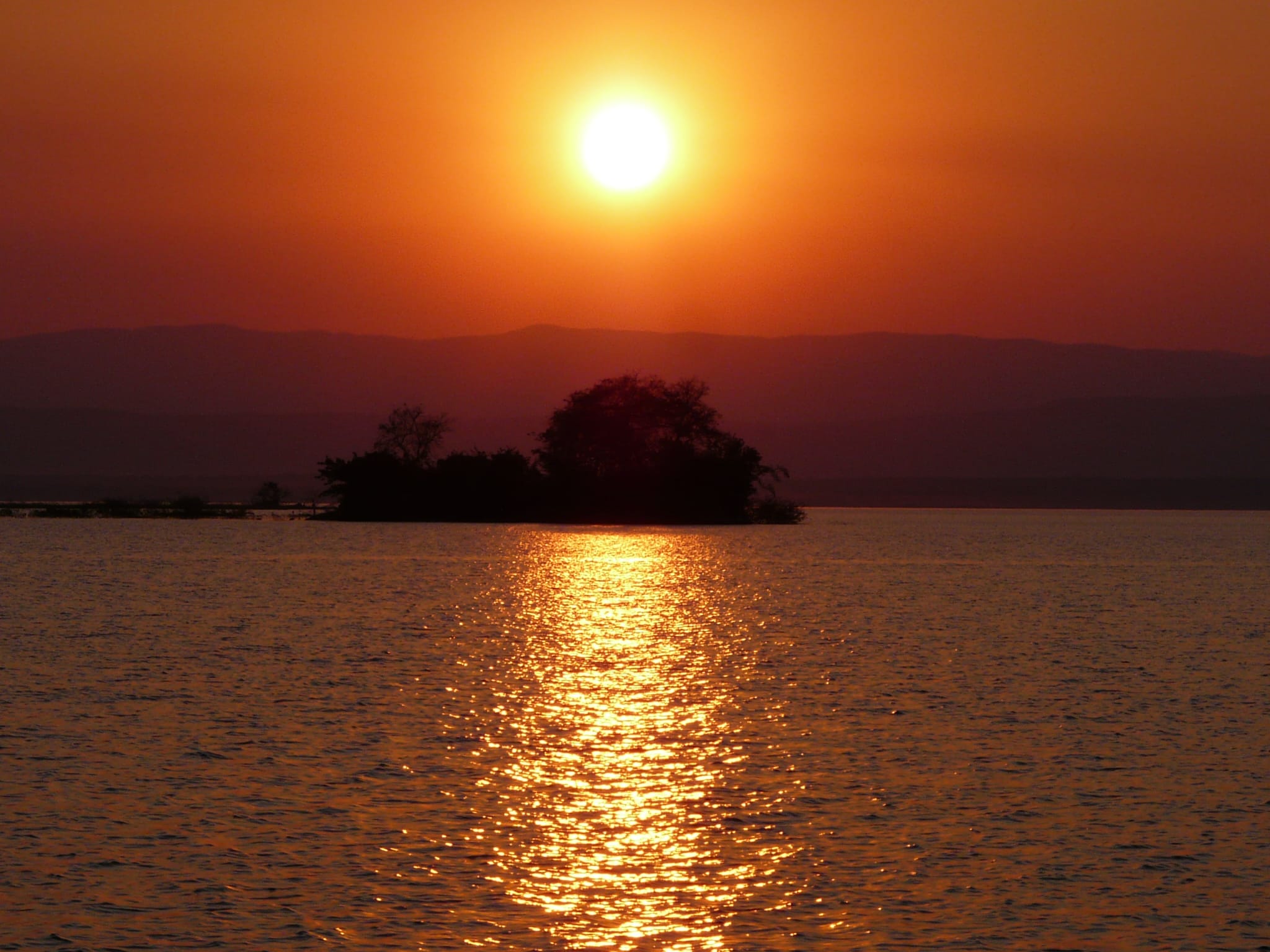 Sonnenuntergang über dem See – Lichterkreise